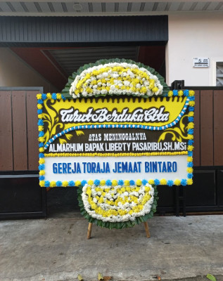 Papan Bunga Duka di Moyag Tampoan